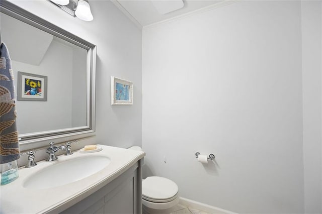 half bath featuring baseboards, vanity, toilet, and crown molding