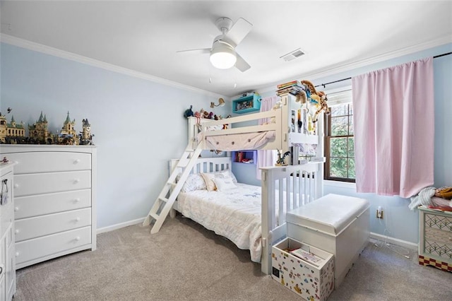 carpeted bedroom featuring a ceiling fan, baseboards, visible vents, and ornamental molding