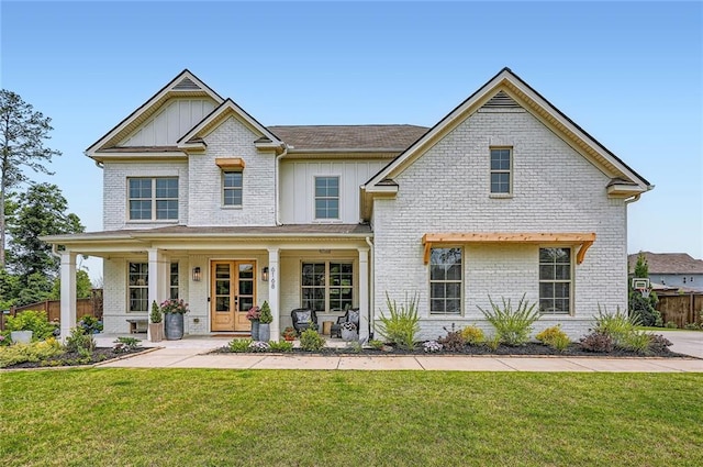 6168 Sweet Birch Ct, Acworth, GA 30101 - craftsman-style home featuring board and batten siding, brick siding, covered porch, and a shingled roof