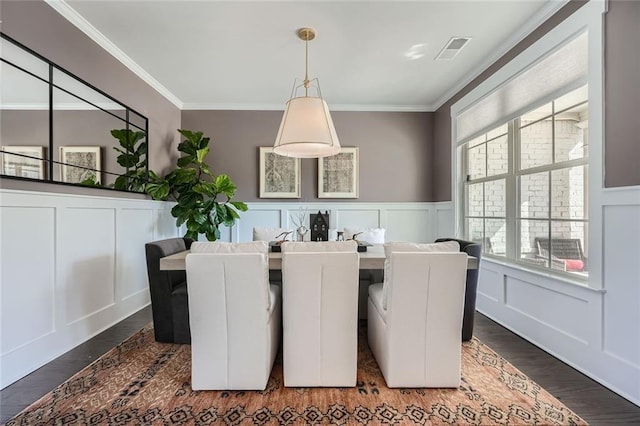 6168 Sweet Birch Ct, Acworth, GA 30101 - dining room with a decorative wall, crown molding, dark wood finished floors, healthy amount of natural light, and wainscoting