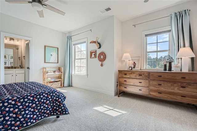 6168 Sweet Birch Ct, Acworth, GA 30101 - carpeted bedroom featuring multiple windows, ensuite bath, and ceiling fan