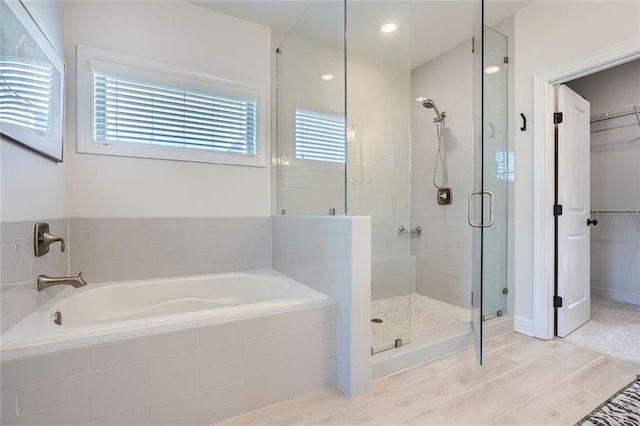 6168 Sweet Birch Ct, Acworth, GA 30101 - full bathroom featuring a bath, a stall shower, a spacious closet, and healthy amount of natural light