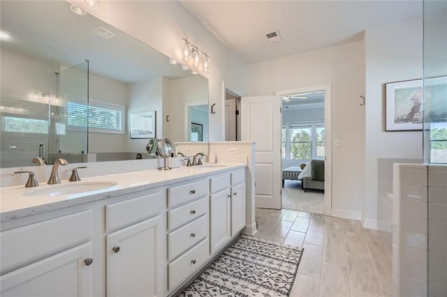 6168 Sweet Birch Ct, Acworth, GA 30101 - full bath featuring double vanity, a garden tub, a shower stall, ensuite bathroom, and wood finished floors