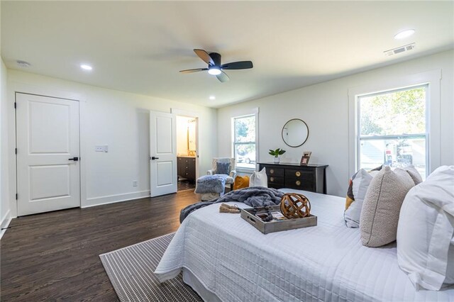 bedroom with dark wood-type flooring, ceiling fan, and multiple windows