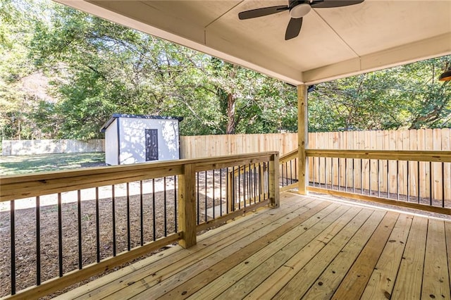 deck with a storage shed and ceiling fan