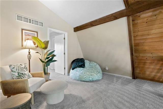 living area with lofted ceiling and light carpet