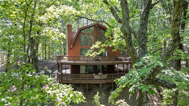 back of house with a wooden deck