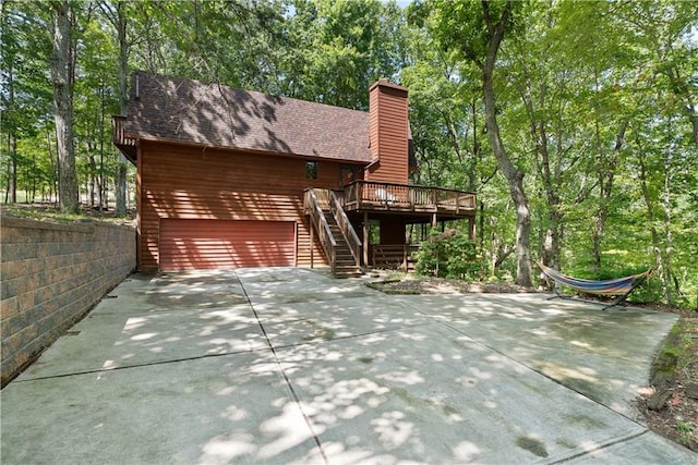 view of side of home with a deck