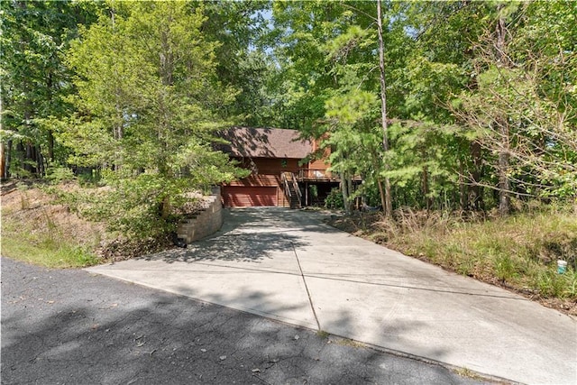 view of front of home with a garage and a deck