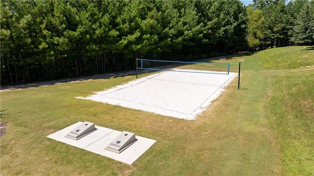 view of community with a yard and volleyball court