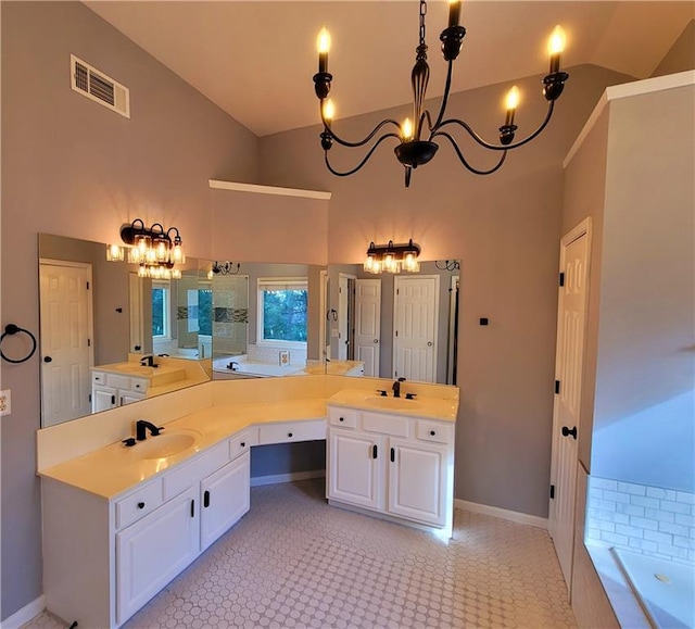 bathroom featuring high vaulted ceiling, vanity, visible vents, baseboards, and a bath