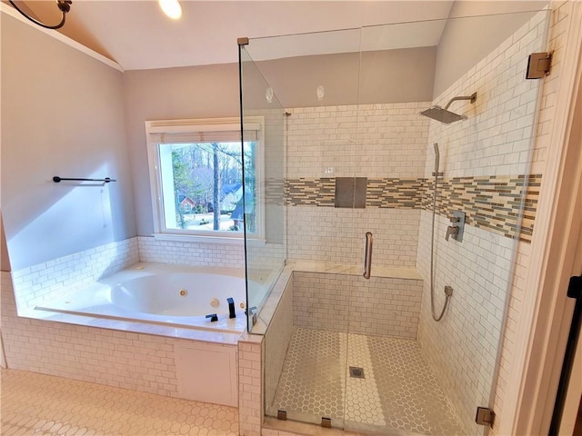 bathroom featuring a tub with jets and a shower stall