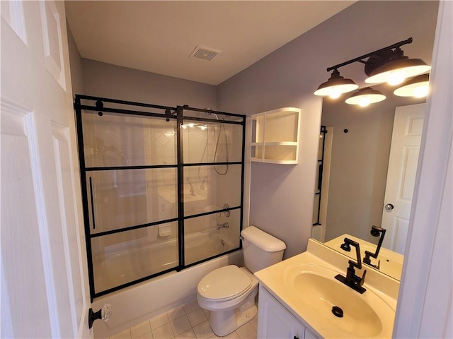 full bath with visible vents, toilet, tile patterned flooring, combined bath / shower with glass door, and vanity