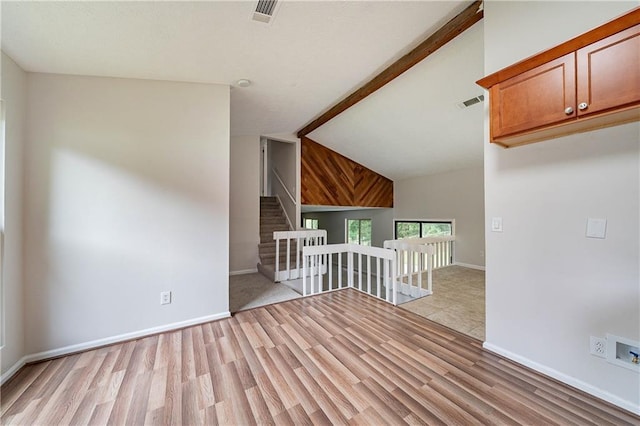 765 Martin Rd, Stone Mountain, GA 30088 - unfurnished room with light wood-style flooring, vaulted ceiling, and baseboards