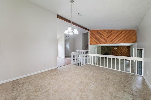 765 Martin Rd, Stone Mountain, GA 30088 - unfurnished room with a chandelier, lofted ceiling, and baseboards