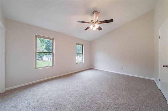 765 Martin Rd, Stone Mountain, GA 30088 - carpeted empty room with vaulted ceiling, a ceiling fan, and baseboards