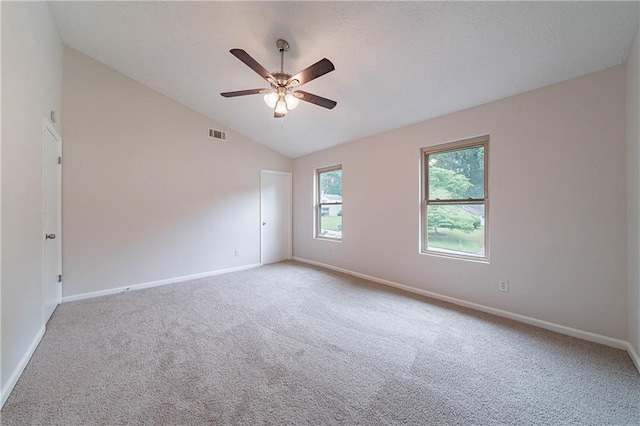 765 Martin Rd, Stone Mountain, GA 30088 - carpeted spare room featuring vaulted ceiling, baseboards, and ceiling fan