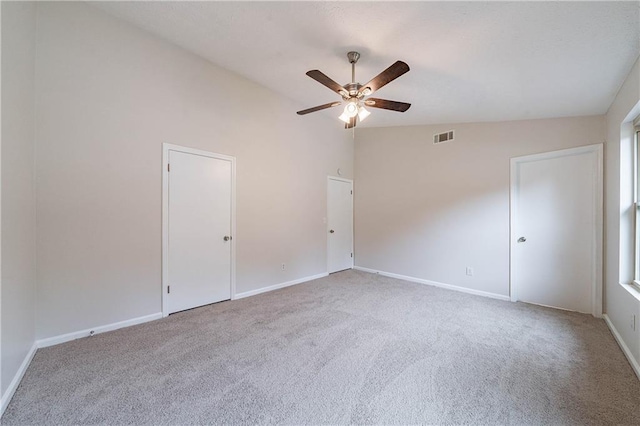 765 Martin Rd, Stone Mountain, GA 30088 - carpeted empty room with ceiling fan, baseboards, and lofted ceiling