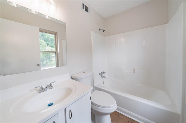 765 Martin Rd, Stone Mountain, GA 30088 - bathroom featuring toilet, washtub / shower combination, and vanity