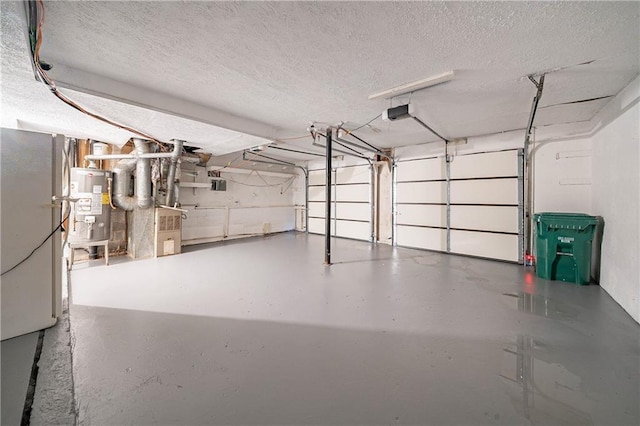 765 Martin Rd, Stone Mountain, GA 30088 - garage with water heater and a garage door opener