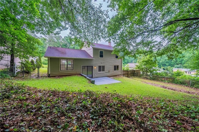 765 Martin Rd, Stone Mountain, GA 30088 - back of property featuring a patio and a chimney