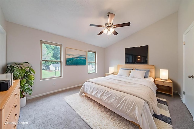 765 Martin Rd, Stone Mountain, GA 30088 - carpeted bedroom with vaulted ceiling, baseboards, and ceiling fan
