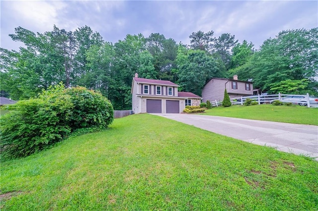 765 Martin Rd, Stone Mountain, GA 30088 - view of front facade with driveway, a chimney, and an attached garage