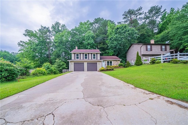 765 Martin Rd, Stone Mountain, GA 30088 - view of front of home featuring concrete driveway, a garage, and a chimney