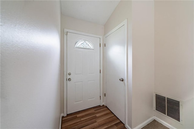 765 Martin Rd, Stone Mountain, GA 30088 - doorway to outside with wood finished floors and baseboards