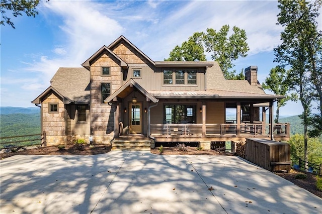 craftsman-style home with a porch and a mountain view