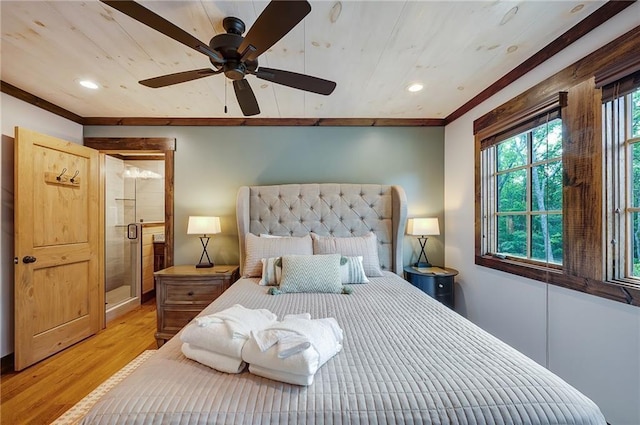 bedroom featuring crown molding, light hardwood / wood-style floors, and ceiling fan