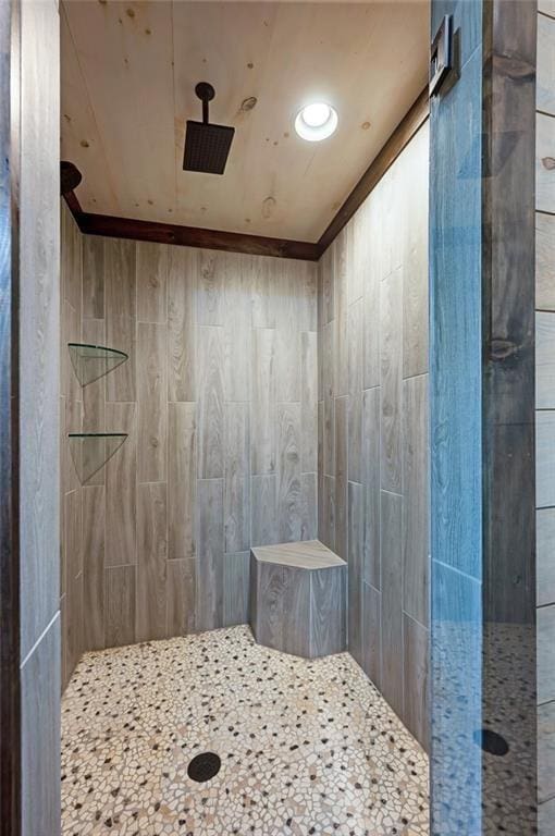 bathroom with a tile shower