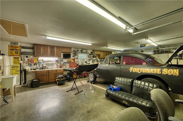 garage featuring a garage door opener and a workshop area