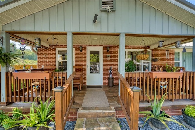 view of exterior entry with covered porch