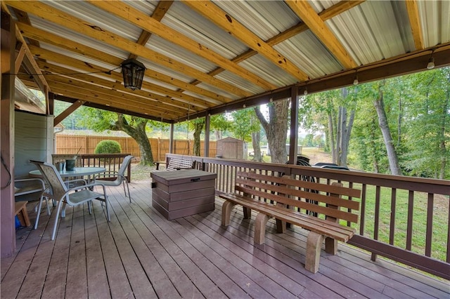 wooden deck with a storage shed