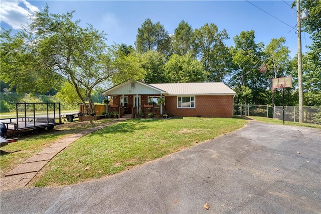 ranch-style home with a front lawn