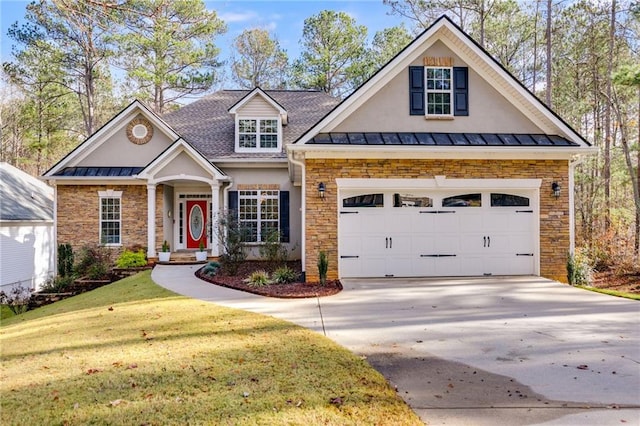 view of front of home featuring a garage and a front lawn