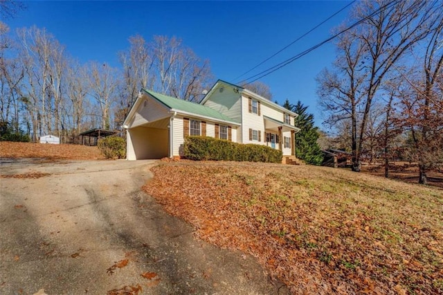 view of side of property featuring a carport