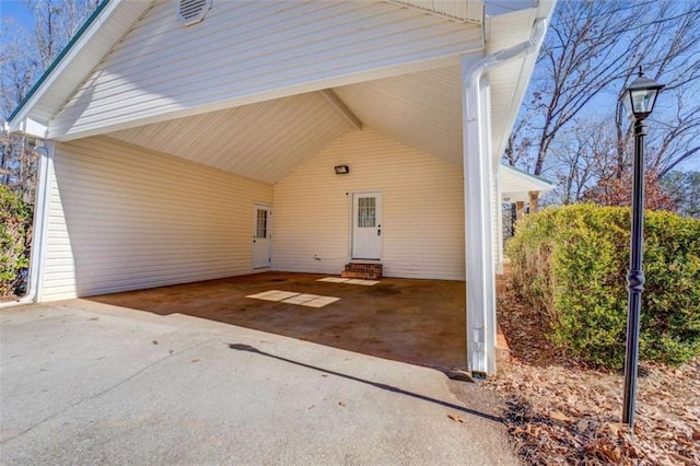 entrance to property featuring a carport