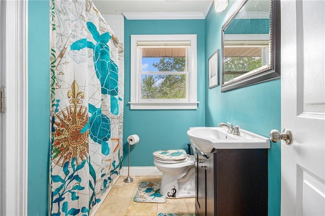 bathroom with crown molding, toilet, plenty of natural light, and vanity