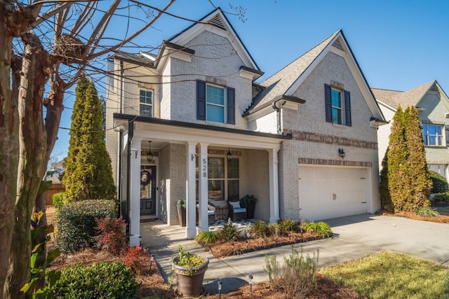 view of front of home featuring a garage and a porch