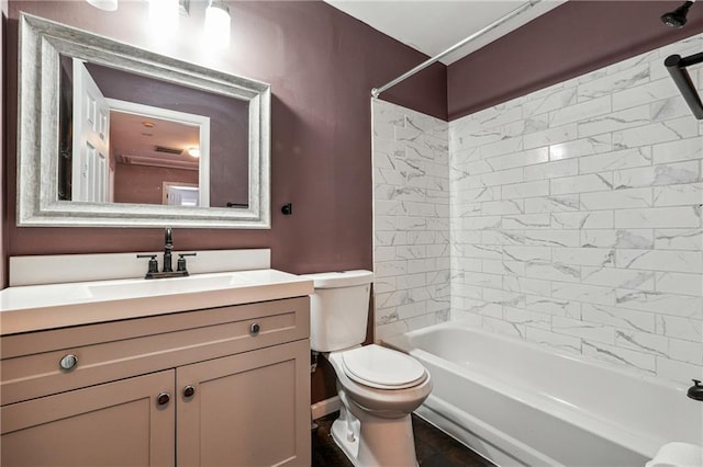 full bath with toilet, vanity, and bathtub / shower combination