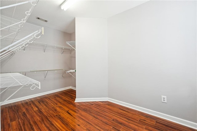 spacious closet with wood finished floors and visible vents