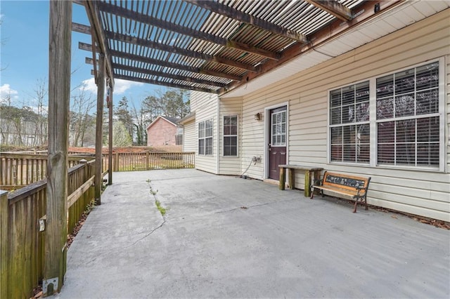 view of patio with fence and a pergola