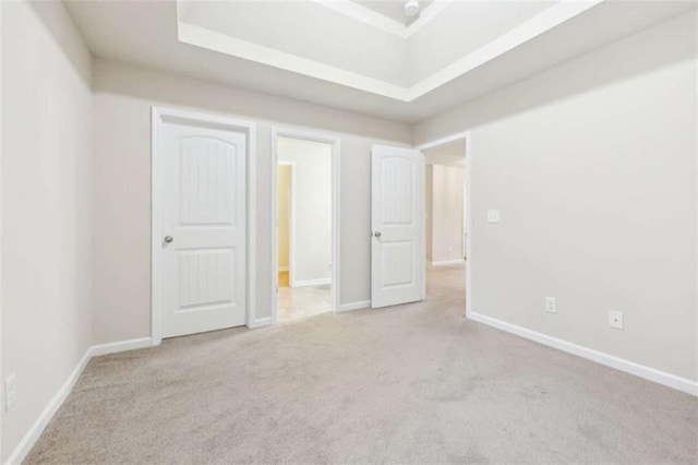 unfurnished bedroom featuring light colored carpet