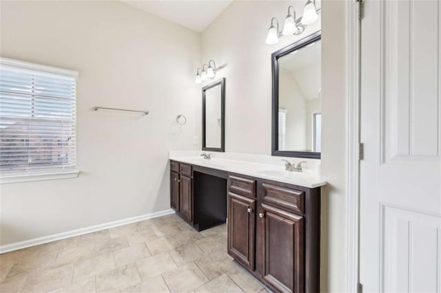 bathroom featuring tile patterned flooring and vanity