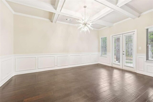 unfurnished room with beamed ceiling, french doors, dark hardwood / wood-style floors, and a notable chandelier