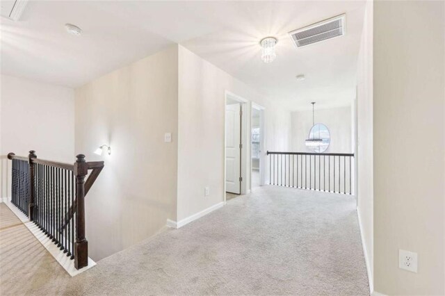 hallway featuring carpet