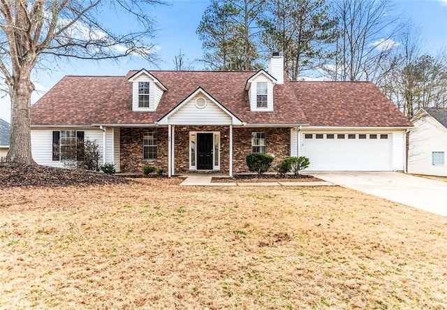 cape cod home featuring a garage and a front yard