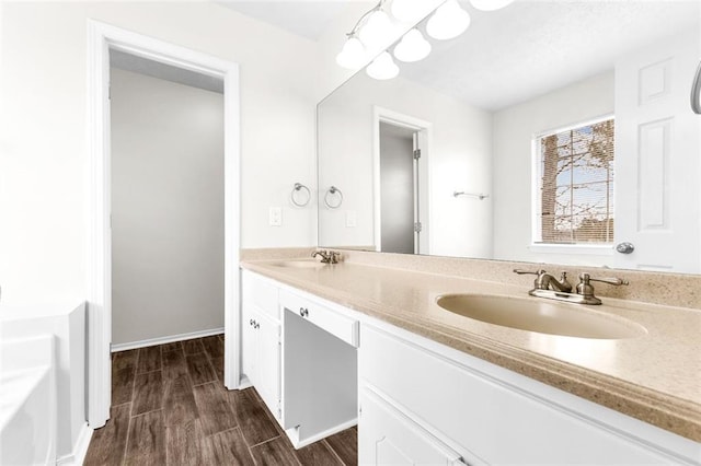 bathroom with vanity and hardwood / wood-style floors